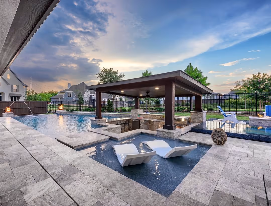 The completed pool and outdoor living space, built to match the rendering